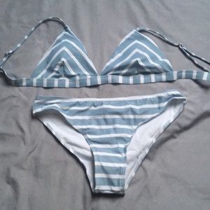 White and light blue gray colored bathing suit.